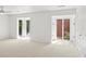 Bright bedroom with neutral carpet, multiple windows, and natural lighting at 49 Willow Gln, Atlanta, GA 30342