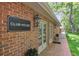Exterior of a clubhouse building featuring classic brickwork and elegant architectural details at 49 Willow Gln, Atlanta, GA 30342