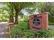 Brick sign for Willow Glen, a private community, surrounded by lush greenery, enhancing curb appeal at 49 Willow Gln, Atlanta, GA 30342