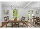 Bright dining room with hardwood floors, chandelier, and large mirror, perfect for entertaining guests at 49 Willow Gln, Atlanta, GA 30342