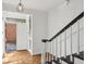 Bright foyer with hardwood floors, open entryway and staircase at 49 Willow Gln, Atlanta, GA 30342