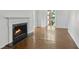 Spacious living room with hardwood floors and a cozy fireplace at 49 Willow Gln, Atlanta, GA 30342
