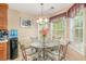 Charming breakfast nook with windows and decorative chandelier; perfect for casual dining at 1335 Vine Cir, Mcdonough, GA 30253