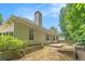 Exterior of home featuring neutral siding, a brick chimney and patio area at 1335 Vine Cir, Mcdonough, GA 30253