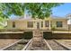 Rear exterior view of the home showing the patio, windows, and well-maintained backyard at 1335 Vine Cir, Mcdonough, GA 30253
