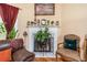 A close-up view of a lovely fireplace with decorative mantel and comfortable seating nearby at 1335 Vine Cir, Mcdonough, GA 30253