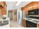 Functional kitchen featuring stainless steel appliances, laminate counters, and ample cabinetry at 1335 Vine Cir, Mcdonough, GA 30253