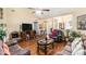 Expansive living room featuring vaulted ceilings, wood floors, and multiple seating areas at 1335 Vine Cir, Mcdonough, GA 30253