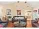 Spacious living area with wood floors, comfortable seating and view to a dining area at 1335 Vine Cir, Mcdonough, GA 30253