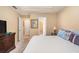 Spacious main bedroom featuring a tray ceiling, neutral paint colors, and carpeting at 1335 Vine Cir, Mcdonough, GA 30253