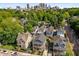 Aerial view of the neighborhood with mature trees and the downtown skyline in the background at 174 Crumley St, Atlanta, GA 30312