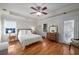 Cozy bedroom with hardwood floors, neutral colors, and natural light from two windows at 174 Crumley St, Atlanta, GA 30312