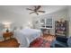 This bedroom features hardwood floors, a ceiling fan and desk at 174 Crumley St, Atlanta, GA 30312