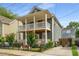 Two-story home with covered porches, fenced yard, and driveway at 174 Crumley St, Atlanta, GA 30312