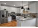 Modern kitchen features granite countertops, stainless steel appliances, and white cabinetry at 174 Crumley St, Atlanta, GA 30312