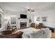 Bright living room with fireplace, plush seating, large windows, and hardwood floors at 174 Crumley St, Atlanta, GA 30312