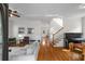 Open-concept living room with hardwood floors, neutral paint, lots of natural light, and cozy seating at 174 Crumley St, Atlanta, GA 30312