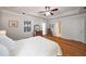 This bedroom features hardwood floors, a ceiling fan, and plenty of natural light at 174 Crumley St, Atlanta, GA 30312