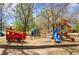 Colorful playground with climbing structures, slides, and a fire truck in a wood chip area at 174 Crumley St, Atlanta, GA 30312