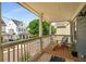 Relaxing porch with wooden floors and comfortable seating overlooking the neighborhood at 174 Crumley St, Atlanta, GA 30312