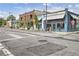 Street view of commercial buildings including a brewery, cafe and shops, with street parking at 174 Crumley St, Atlanta, GA 30312