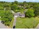 Aerial view of the home showcasing the driveway, well-manicured lawn, and mature trees at 1903 Lochlomand Se Ln, Smyrna, GA 30080