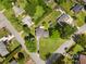 A high aerial view of the home on a corner lot with mature landscaping and surrounding neighborhood at 1903 Lochlomand Se Ln, Smyrna, GA 30080