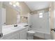 Well-maintained bathroom featuring a shower and tub combination, toilet, and a white vanity at 1903 Lochlomand Se Ln, Smyrna, GA 30080
