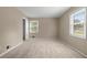 Carpeted bedroom with two windows providing natural light and a large closet at 1903 Lochlomand Se Ln, Smyrna, GA 30080