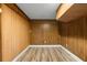 The bedroom features wood-paneled walls, light laminate flooring, and recessed lighting at 1903 Lochlomand Se Ln, Smyrna, GA 30080