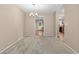 Neutral dining room featuring modern light fixture and view to other rooms at 1903 Lochlomand Se Ln, Smyrna, GA 30080