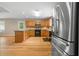 Kitchen with stainless appliances, hardwood floors, granite countertops, and wood cabinets at 1903 Lochlomand Se Ln, Smyrna, GA 30080