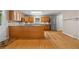 Kitchen featuring wood cabinets, granite countertops, stainless appliances, and hardwood floors at 1903 Lochlomand Se Ln, Smyrna, GA 30080