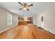 Open living room featuring hardwood floors with lots of light and view of the kitchen at 1903 Lochlomand Se Ln, Smyrna, GA 30080
