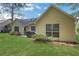 Home's back exterior features a patio, grill, and manicured landscaping at 3001 Garland Sw Dr, Marietta, GA 30008