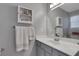 Bathroom featuring a white countertop, gray cabinets, and a mirrored medicine cabinet at 3001 Garland Sw Dr, Marietta, GA 30008