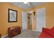 Comfortable bedroom with orange walls, ceiling fan, and antique decorative trunk at 3001 Garland Sw Dr, Marietta, GA 30008