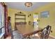 Dining room showcases a wooden table, matching chairs, a decorative cabinet, and a bright yellow wall at 3001 Garland Sw Dr, Marietta, GA 30008