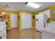 Bright kitchen with white appliances, ample storage space, a utility door, and hardwood floors at 3001 Garland Sw Dr, Marietta, GA 30008