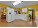 Well-lit kitchen features white appliances, plentiful storage, and seamless flow into the living room at 3001 Garland Sw Dr, Marietta, GA 30008