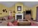Inviting living room featuring a cozy fireplace, stylish decor, comfortable seating, and wood flooring at 3001 Garland Sw Dr, Marietta, GA 30008