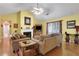 Comfortable living room featuring a fireplace, wood floors, large sofas, and ample natural light at 3001 Garland Sw Dr, Marietta, GA 30008
