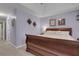 Elegant main bedroom with tray ceilings, neutral decor, and decorative wall accents at 3001 Garland Sw Dr, Marietta, GA 30008