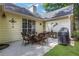 Covered patio features an outdoor dining set and grill, perfect for entertaining at 3001 Garland Sw Dr, Marietta, GA 30008