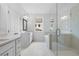 Bright bathroom with a glass shower, soaking tub, and dual sink vanity at 711 Dodd N Ln # 166, Buford, GA 30518