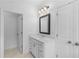 Bright bathroom with white vanity, modern fixtures, and tile flooring at 711 Dodd N Ln # 166, Buford, GA 30518
