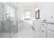Bright bathroom featuring marble floors, glass shower, and white cabinets at 711 Dodd N Ln # 166, Buford, GA 30518
