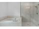 Luxurious bathroom with a glass-enclosed shower and separate soaking tub at 711 Dodd N Ln # 166, Buford, GA 30518