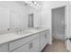 Modern bathroom featuring double vanity with white countertops and cabinets at 711 Dodd N Ln # 166, Buford, GA 30518
