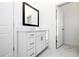 Modern bathroom with a white vanity, dark framed mirror, and access to a water closet at 711 Dodd N Ln # 166, Buford, GA 30518
